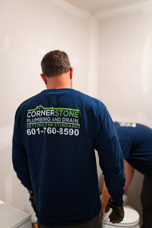 Cornerstone Plumbing and Drain staff helps each other to complete jobs safely and swiftly.